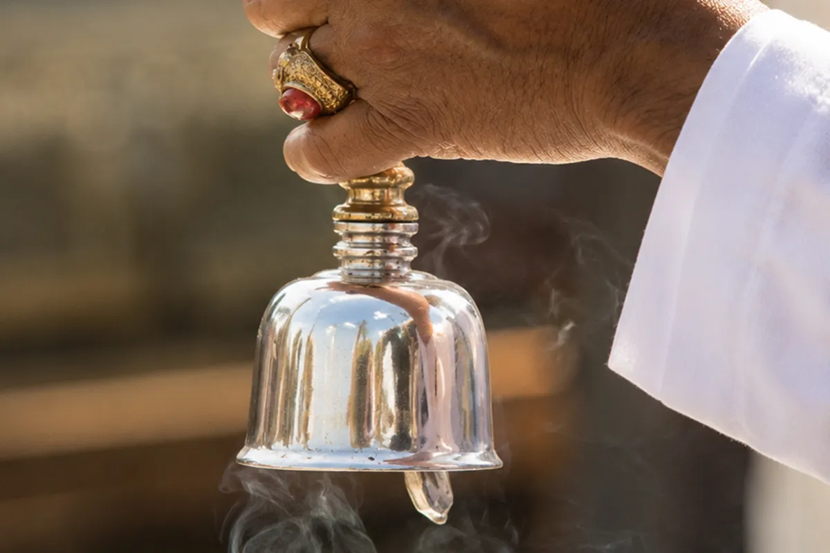 Cast bronze Bali Genta hand bell held during ceremony